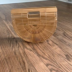 Woven hand clutch bag